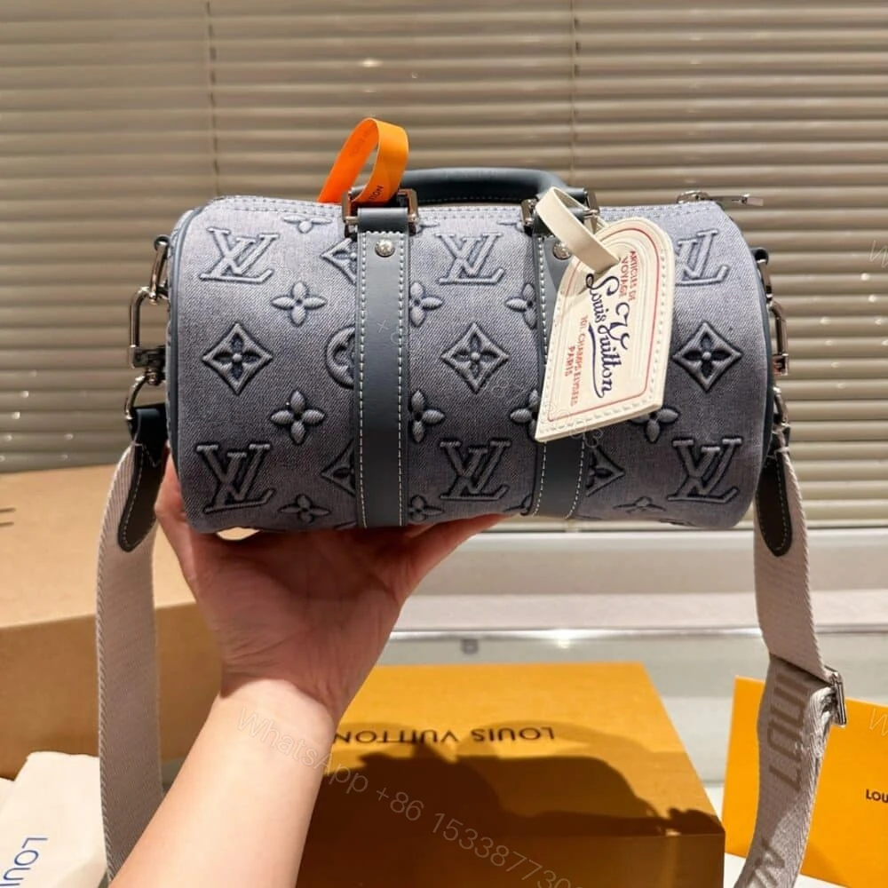 View 3 of Louis Vuitton Keepall Bandoulière 25 Monogram Washed Denim Canvas 24Cm M22762