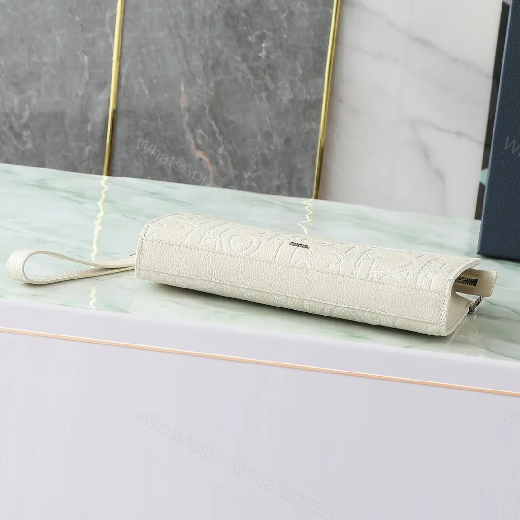 View 7 of Refined Monogram Clutch: Textured Grain, Silver Hardware, Lightweight Crossbody
