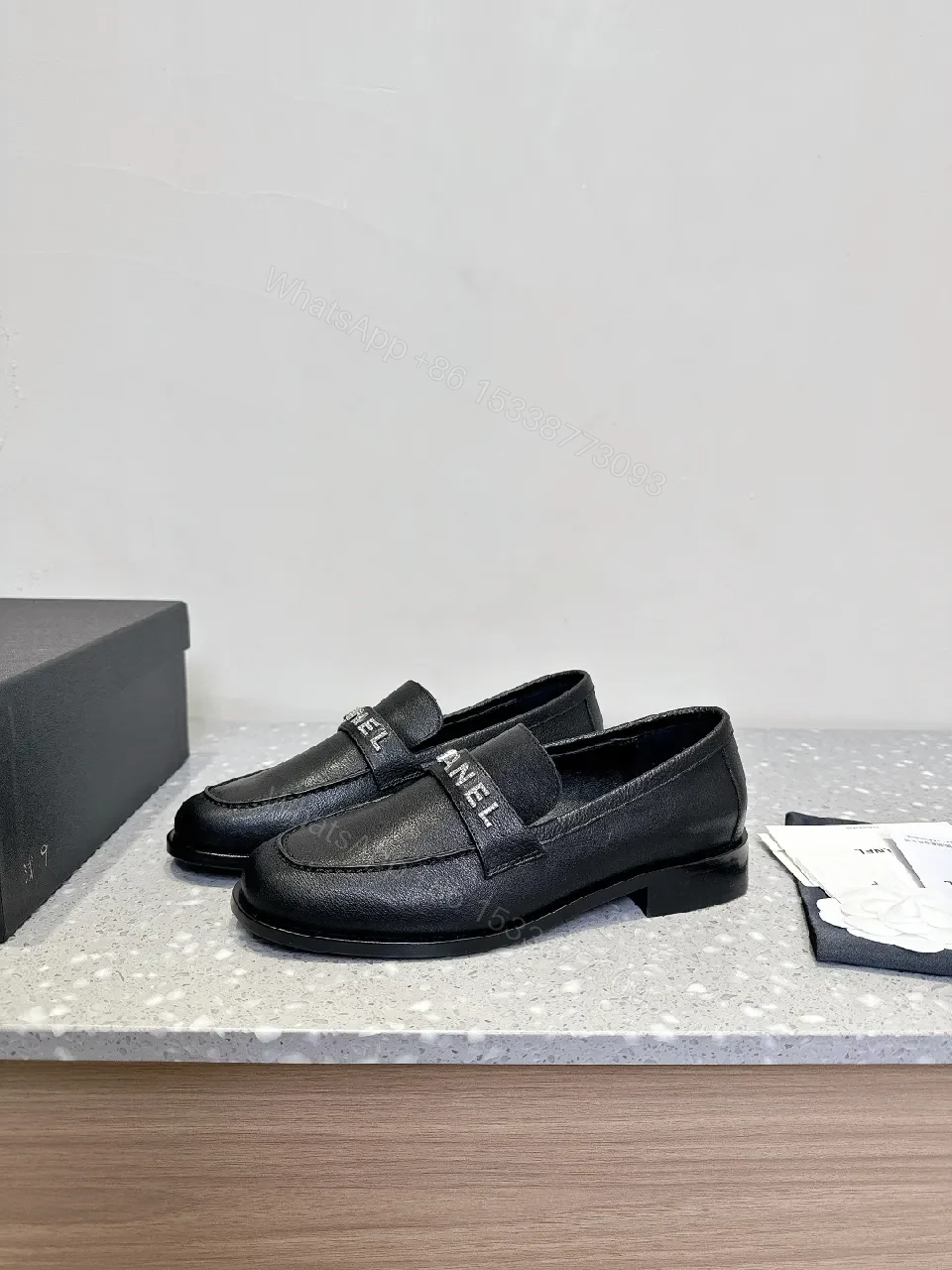 View 2 of Black Leather Slip-On with Logo Strap – Modern Luxe Comfort