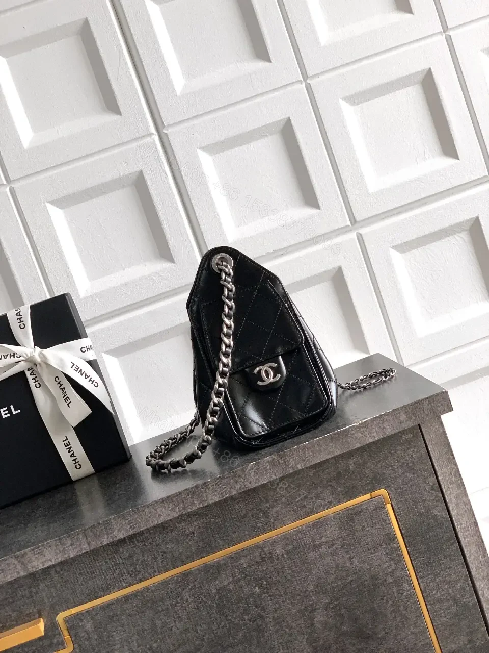 View 7 of Quilted Black Leather Bag with Chain Strap—Compact Elegance