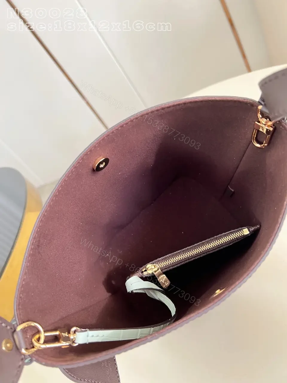 View 2 of Brown Monogram Bucket Bag: Structured Crossbody with Aqua Strap