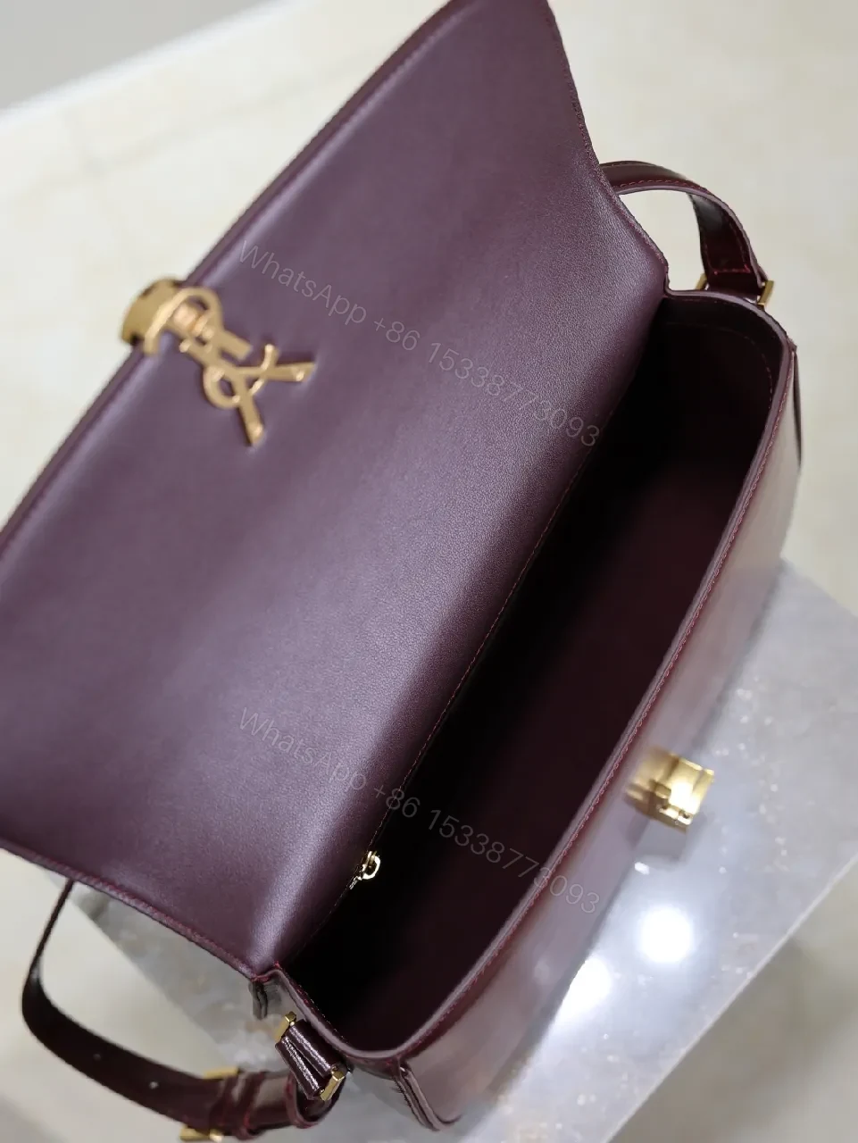 View 7 of Structured Burgundy Leather Crossbody: Gold Logo, Modern Chic
