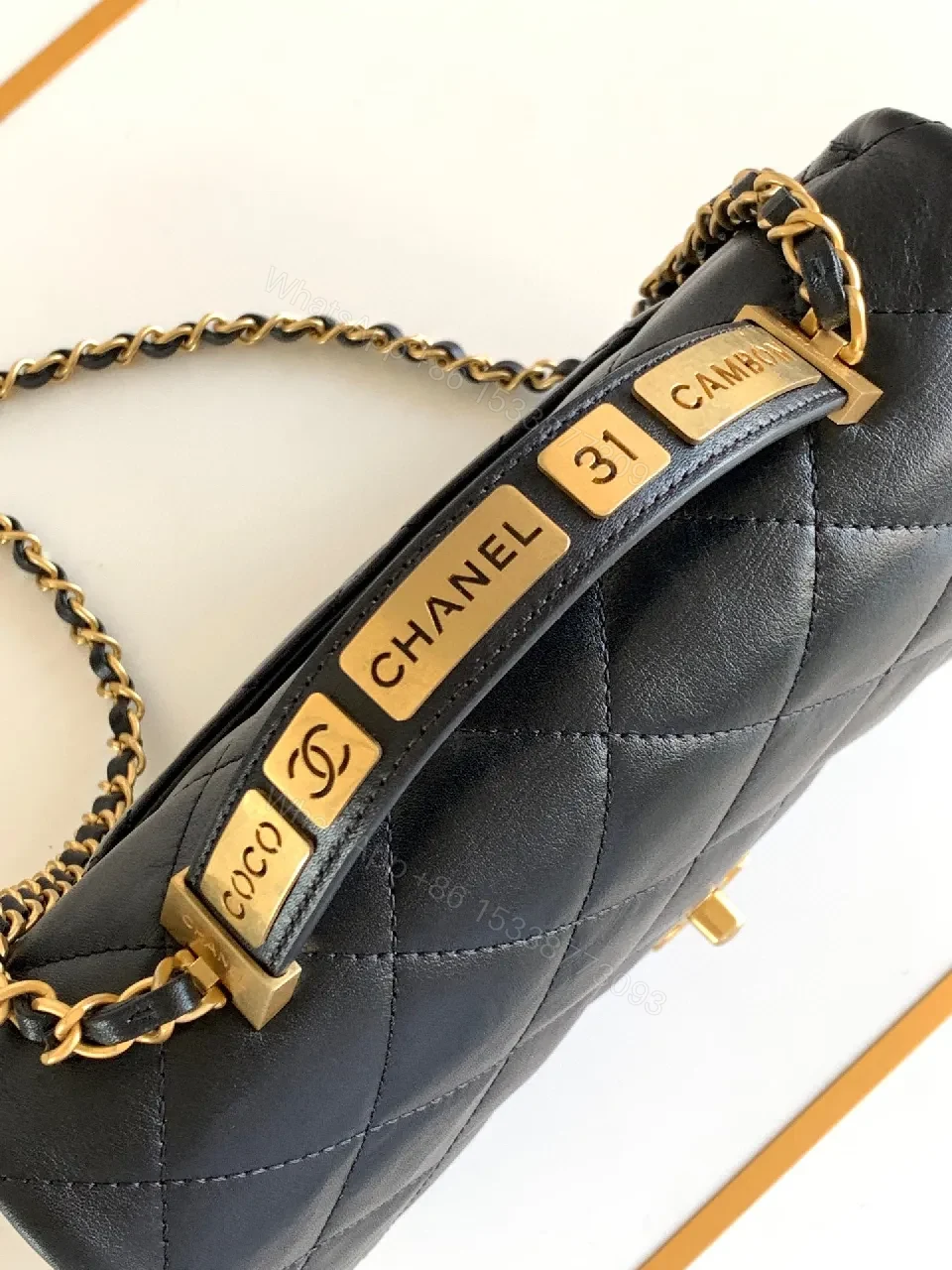 View 6 of Compact Dark Leather Quilted Flap Bag with Gold Hardware
