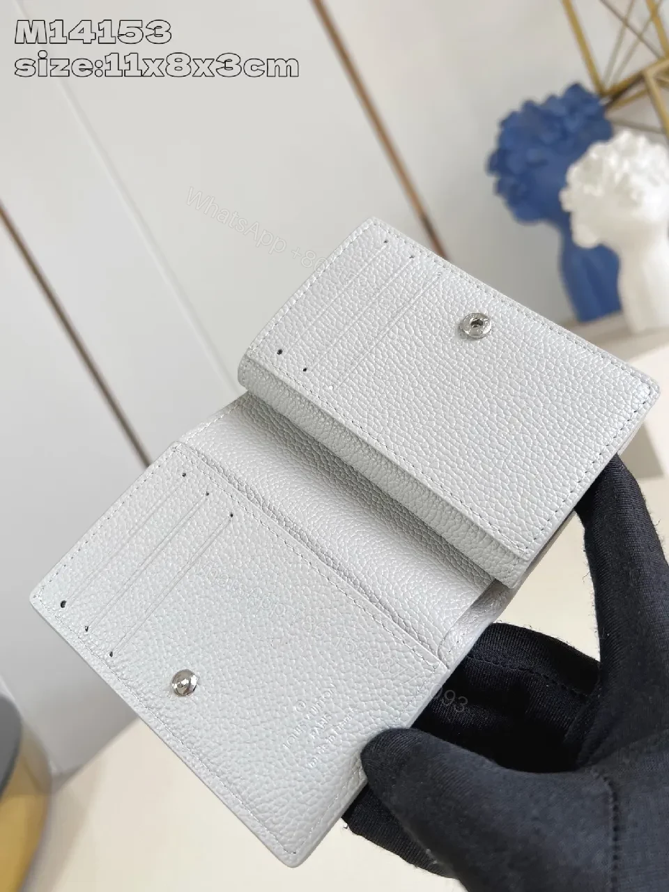 View 4 of Textured Leather Compact Wallet: Monogram Accent, Secure Zip, Minimal Luxury