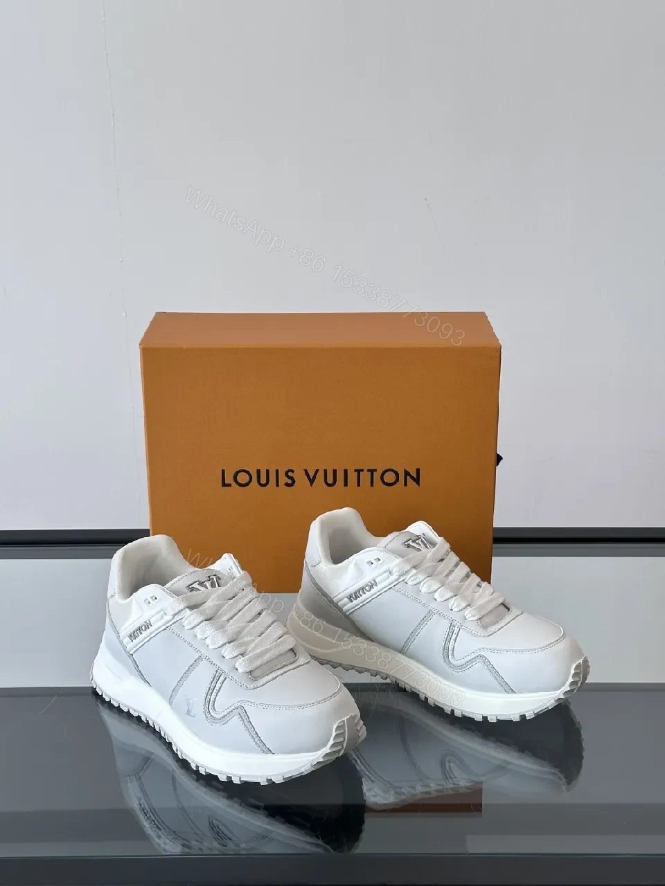 View 8 of Minimalistic White Leather Sneakers with Subtle Texture and Monogram Accent