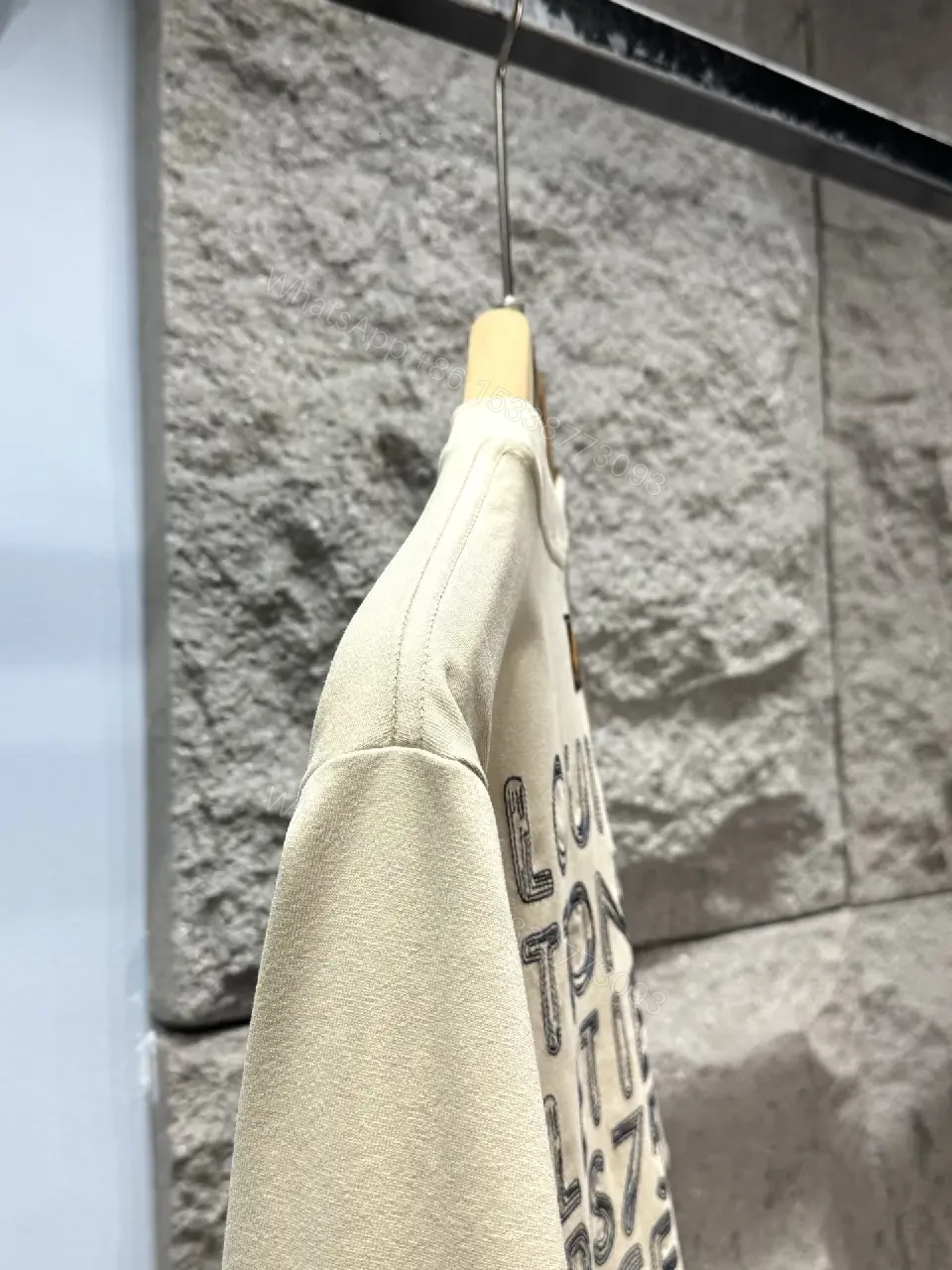 View 7 of Neutral Beige Luxe Tee: Soft Knit, Subtle LVM Monogram, Modern Fit
