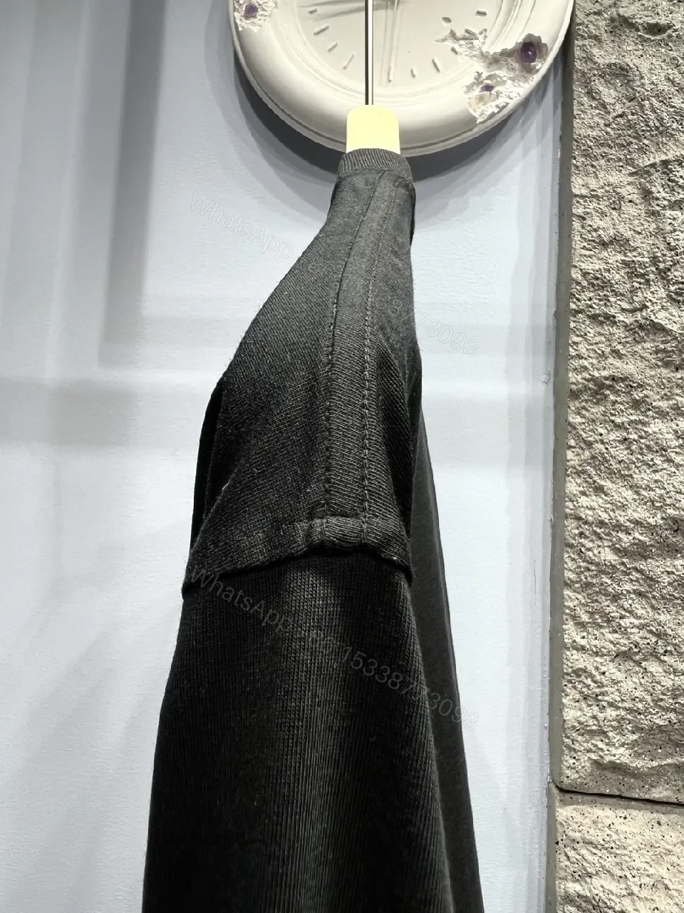 View 10 of Minimalist Black Cotton Tee with Elevated Logo Texture