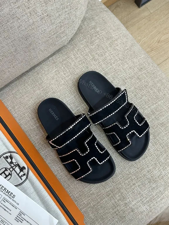 Hermes-Inspired Black Slides with Geometric Stitch Detailing — view 1