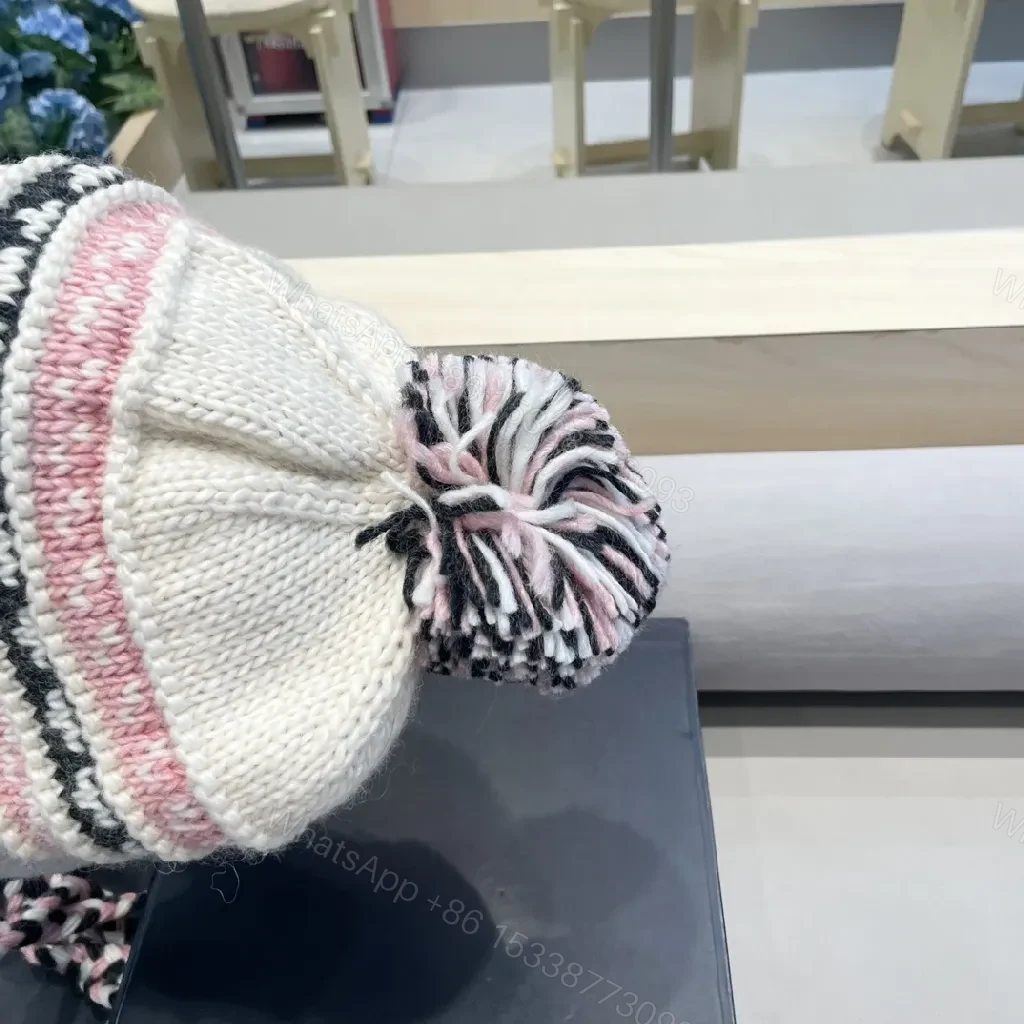 View 2 of Chic Knit Pom Beanie with Braided Tie-Through Straps