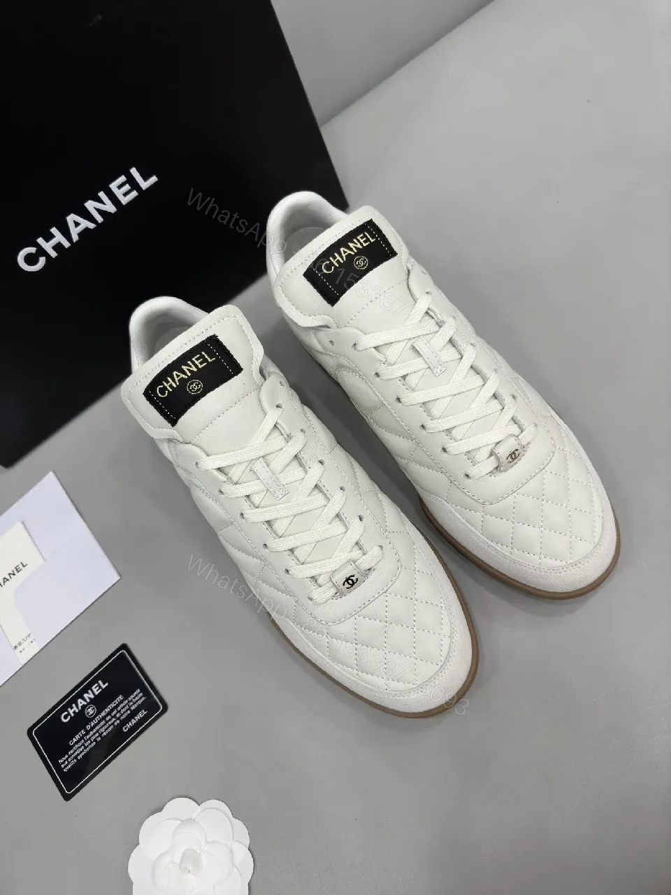 White Quilted High-Top Leather Sneakers with Signature Details — view 1