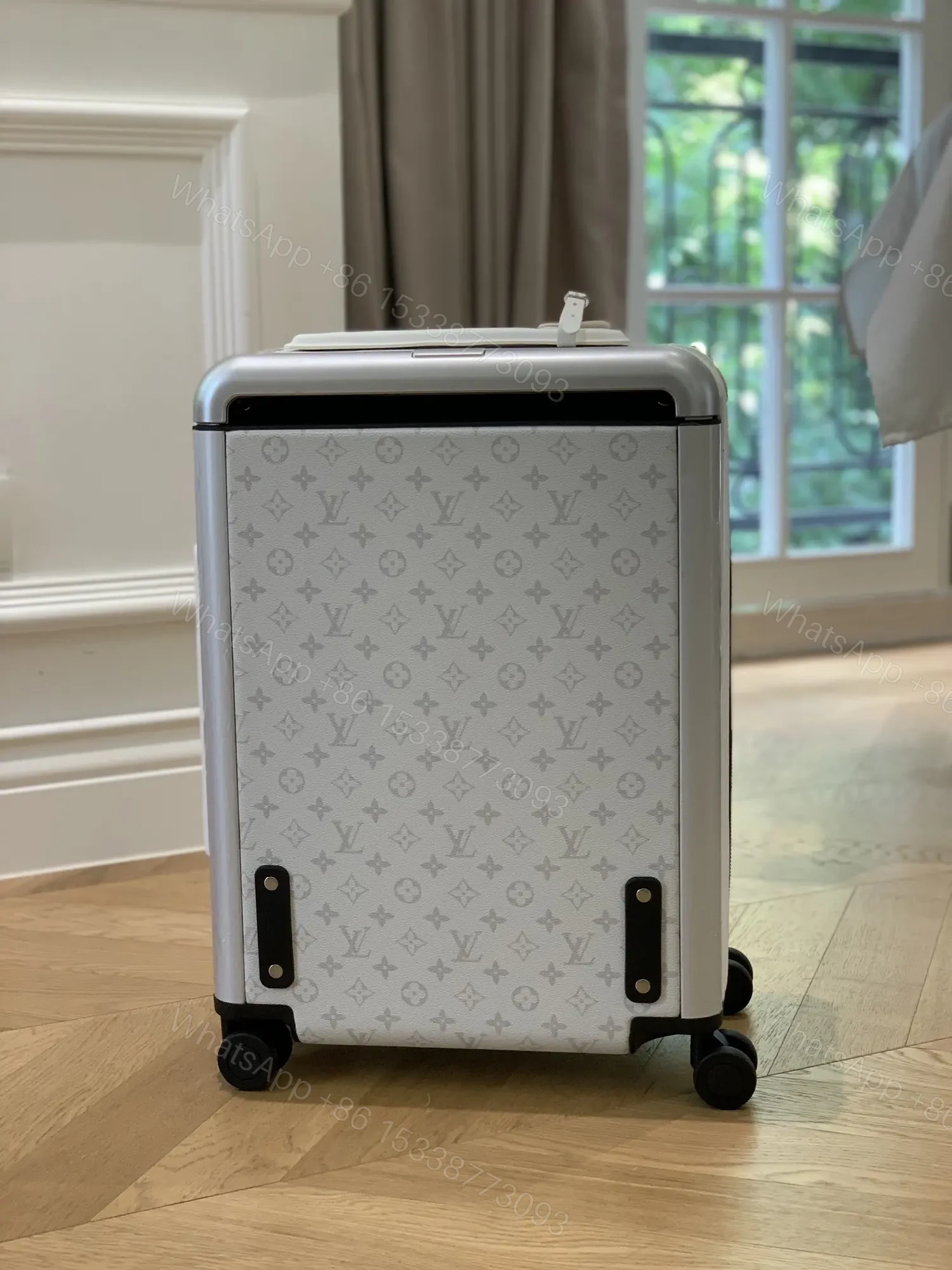 View 2 of Louis Vuitton Horizon 55 in Optic White Monogram canvas