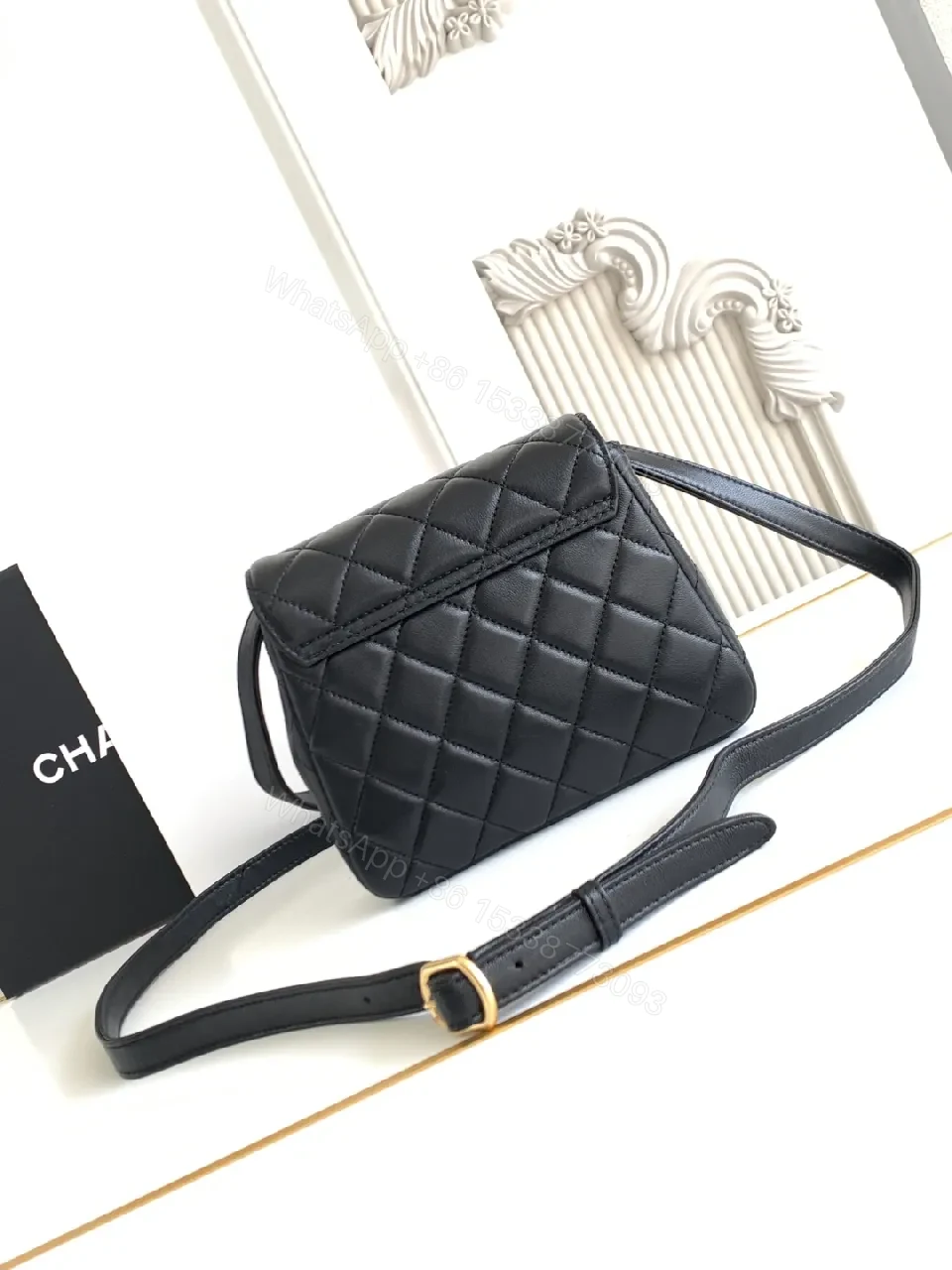 View 2 of Compact Black Quilted Bag with Gold Hardware