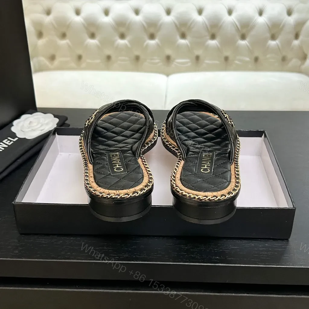 View 5 of Black Quilted Slip-Ons with Chain Trim: Elevated Comfort