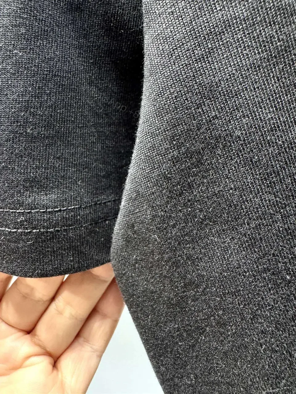 View 9 of Minimalist Black Tee with Subtle Logo – Everyday Luxe Tee