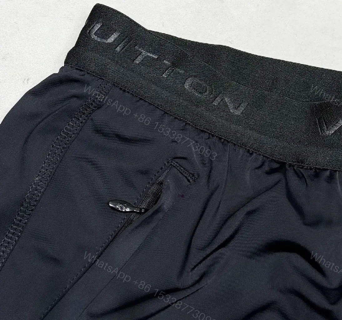 View 5 of Matte Black Quick-Dry Shorts with Subtle LV Detailing