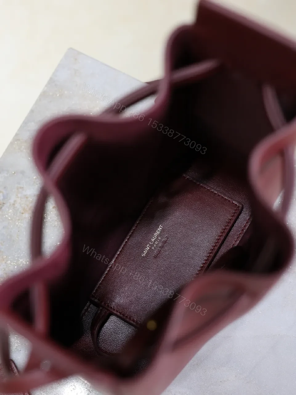 View 3 of Deep Bordeaux Leather Drawstring Bucket Bag—Elevated Everyday Style
