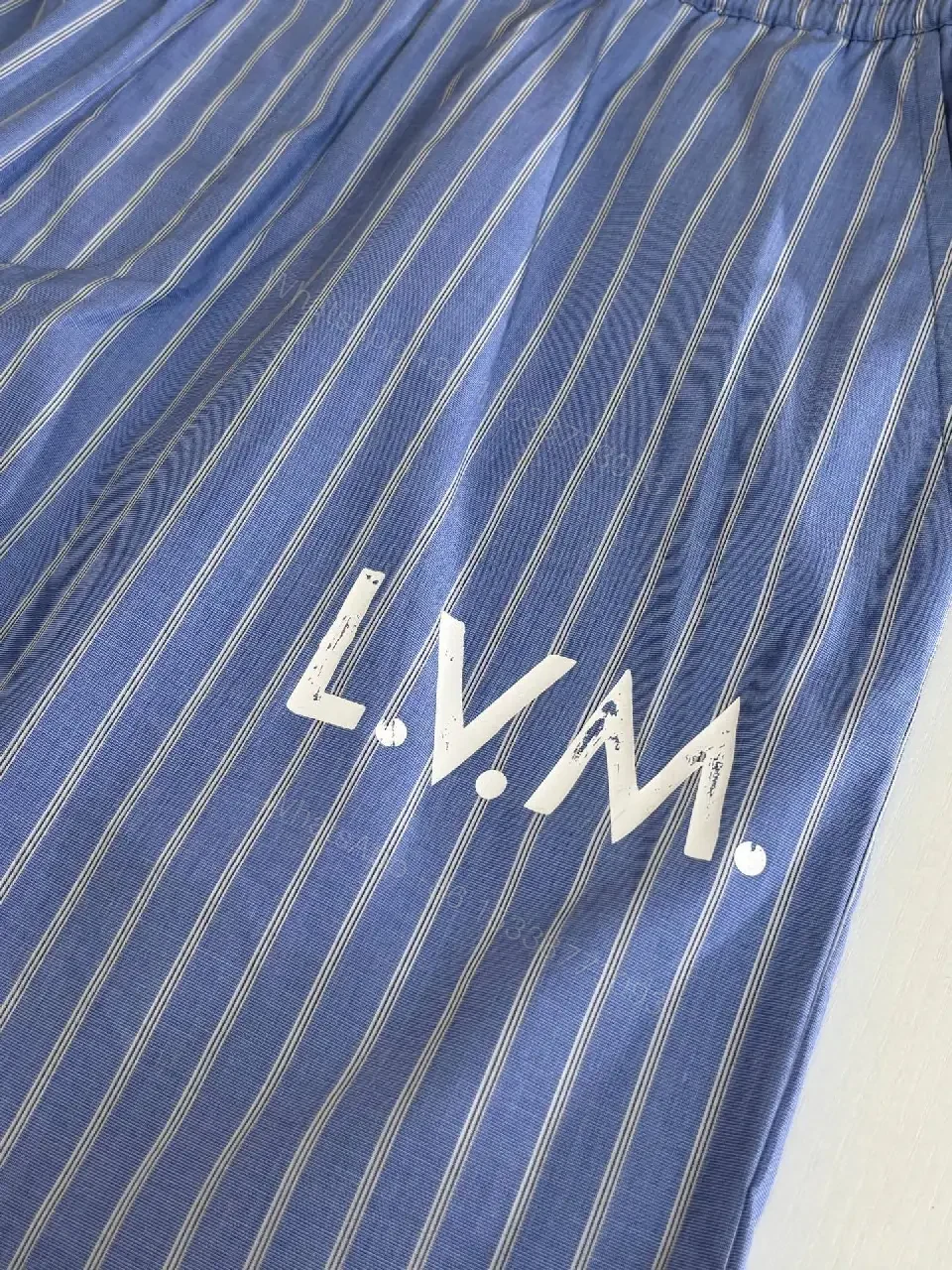 View 4 of Blue Striped Lightweight Drawstring Shorts - Subtle Embossed Logo Luxury