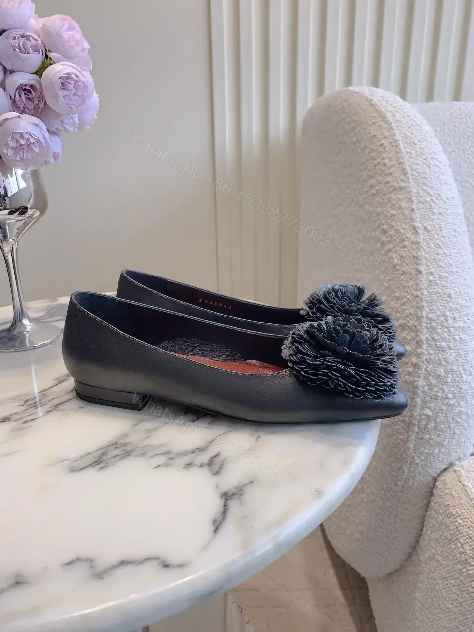 View 4 of Chic Black Pointed Flats with Floral Pom-Pom Detail