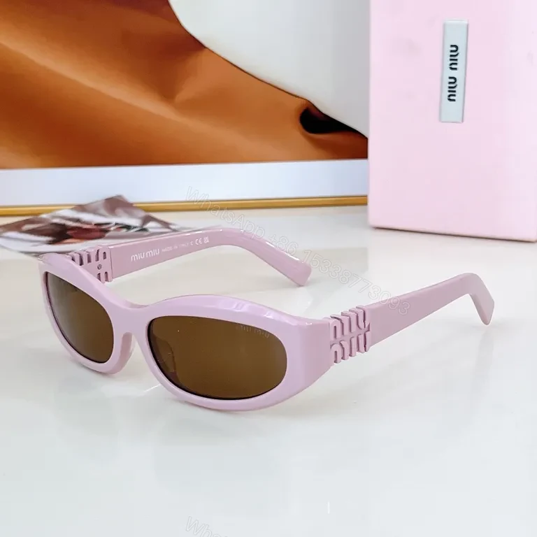View 8 of Chic Black Miu Miu Sunglasses with Gold Accent - All-Day Shield