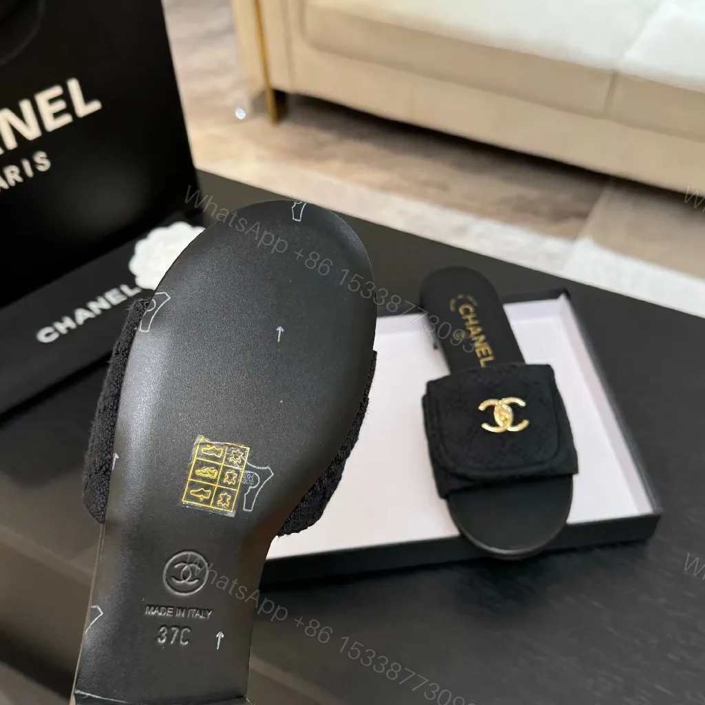 View 2 of Quilted Black Slip-Ons with Gold Logo – Luxury Comfort