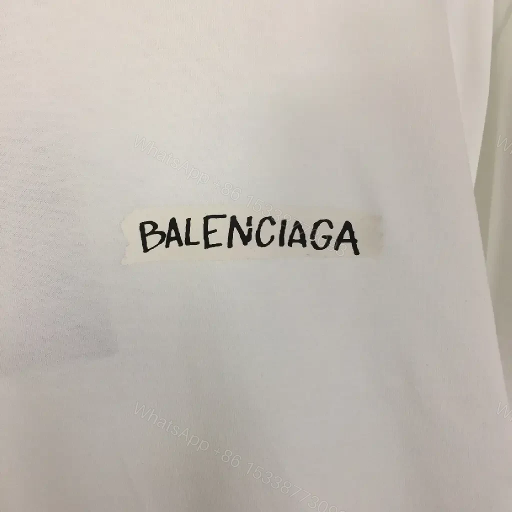 View 4 of Minimalist White Tee with Luxe Subtle Logo – Modern Essential T-Shirt