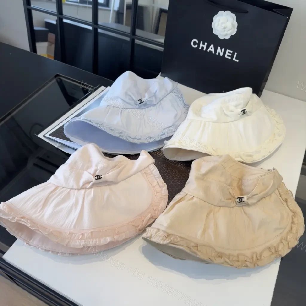 View 4 of Pastel Blue Floppy Hat with Ruffled Brim & Chanel Charm