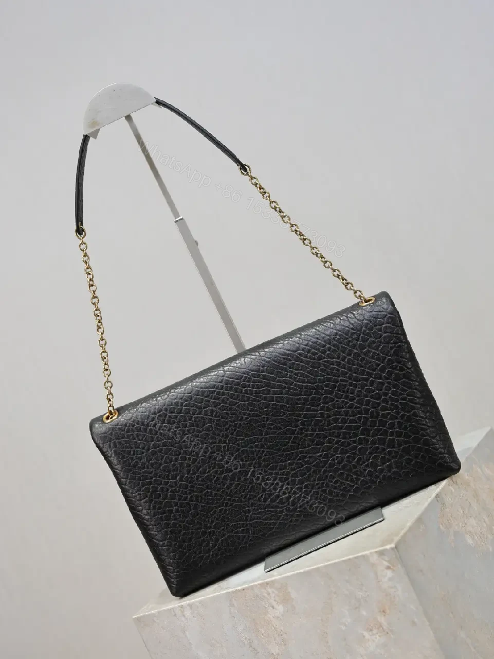 View 4 of Pebbled Leather Envelope Flap Bag, Gold Logo, Day-to-Night Versatility