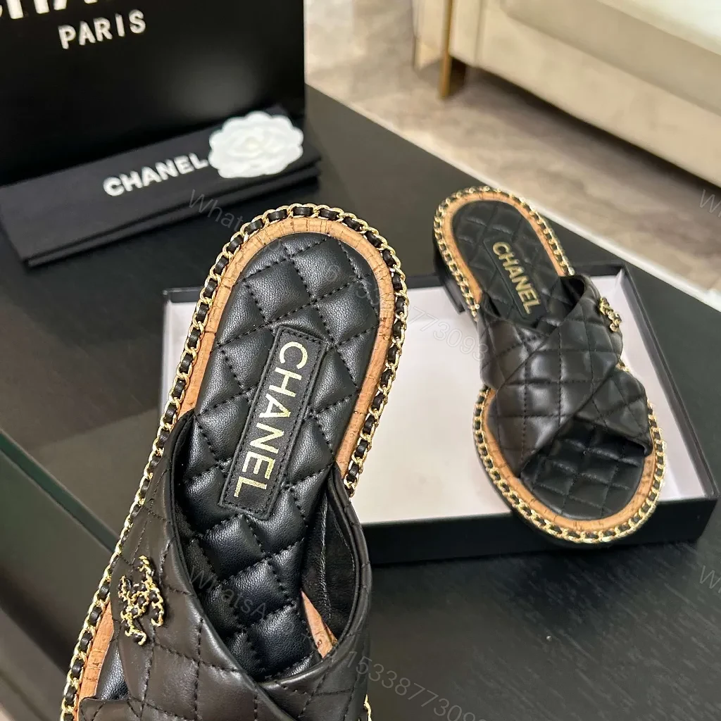 View 2 of Black Quilted Slip-Ons with Chain Trim: Elevated Comfort