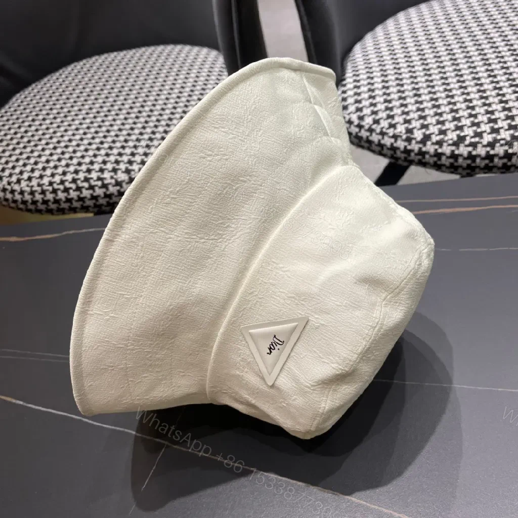 View 5 of Compact Luxury Bucket Hat with TriangleEmblem, Off-White, Textured Weave