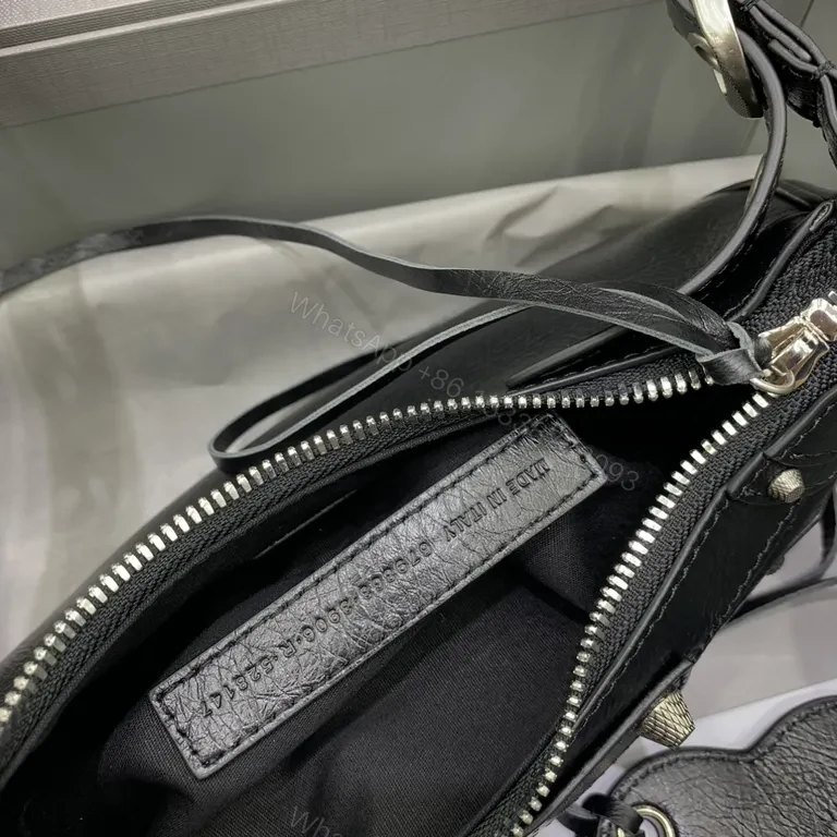 View 3 of Sculpted Black Leather Messenger Bag with Brass Accents