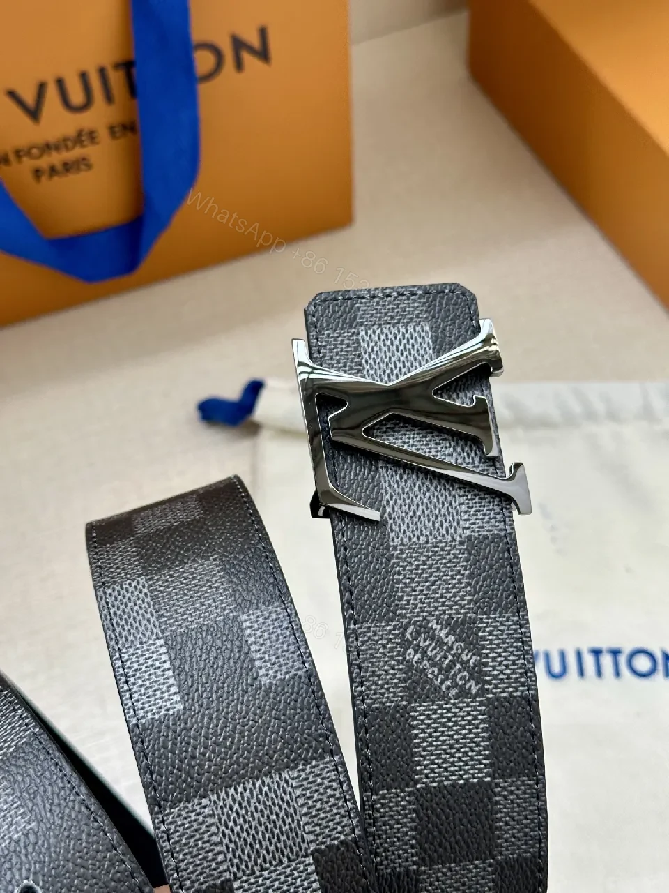 View 2 of Checkerboard Canvas Belt with Signature Buckle – Premium Modern Accessory