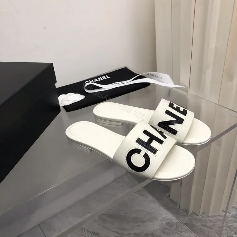 View 9 of Chanel-Inspired White Leather Slides with Bold Logo Strap