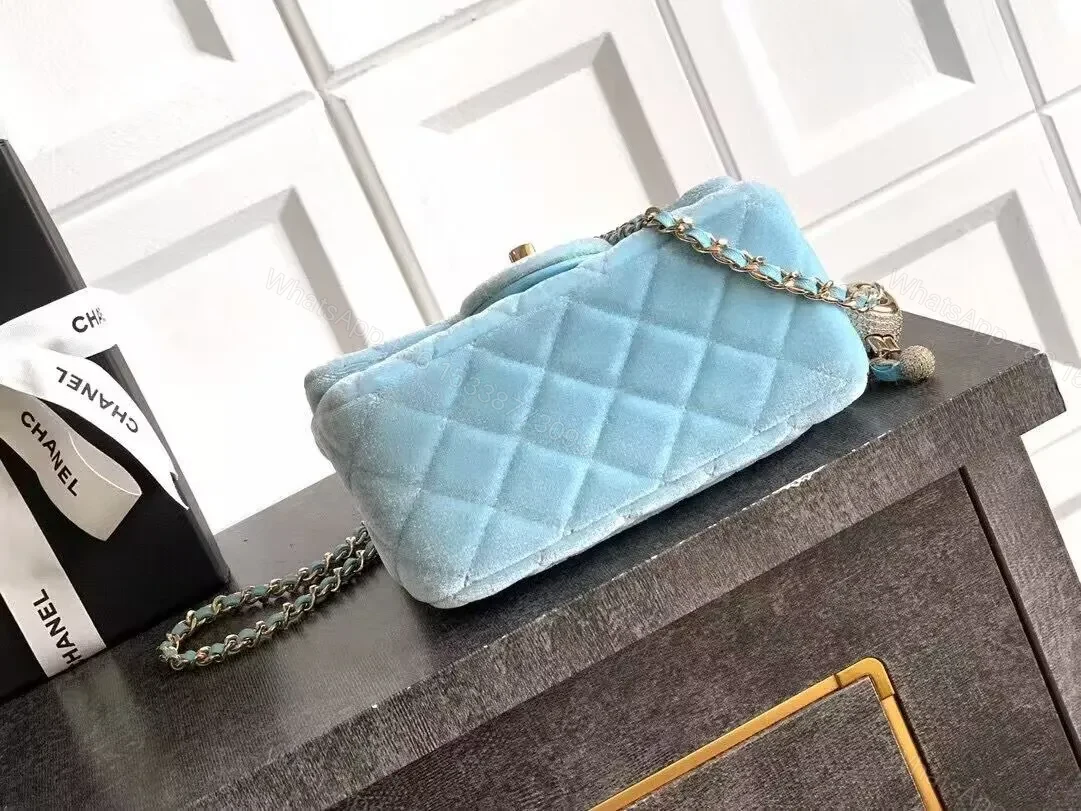 View 4 of Sky-Blue Quilted Mini Bag: Diamond Pattern, Gold Hardware, Crossbody Versatile