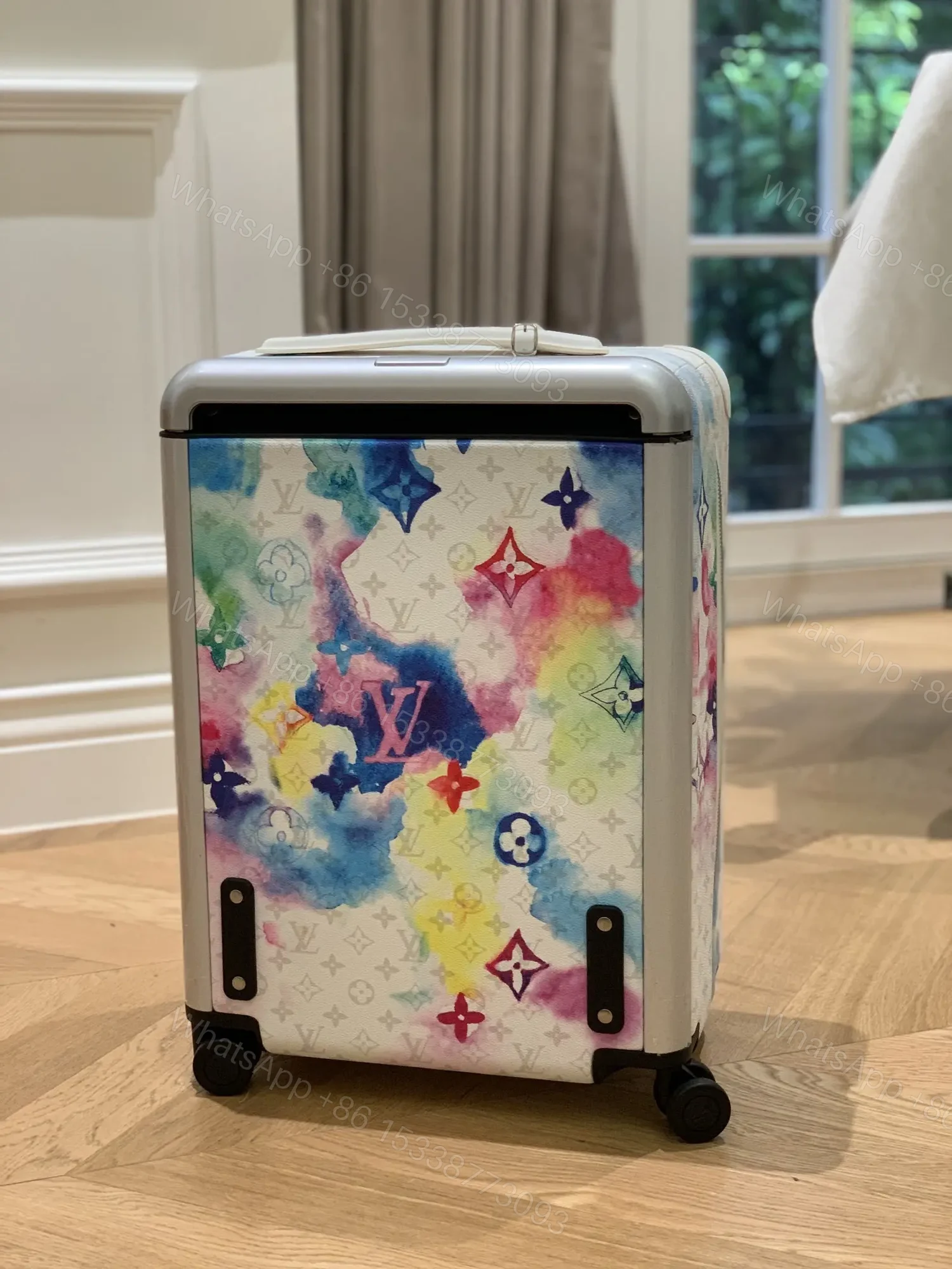 View 3 of Louis Vuitton Horizon 55 suitcase in the Watercolor Multicolor