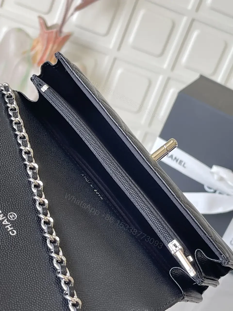 View 9 of Black Quilted Leather Mini Bag - Chain Handle, Compact Luxury