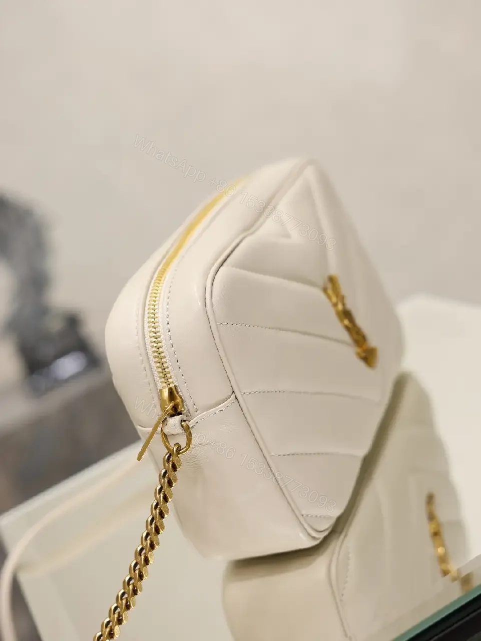 View 5 of Off-White Cream Quilted Chevron Crossbody Bag with Gold Logo
