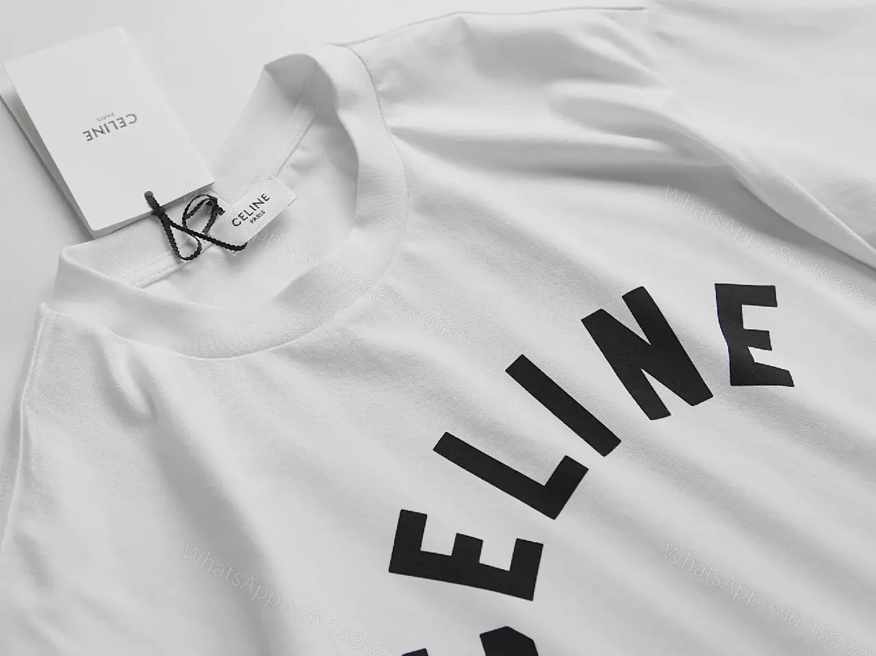 View 8 of White Cotton Graphic Tee: Bold CELINE-Inspired Minimalist Shirt