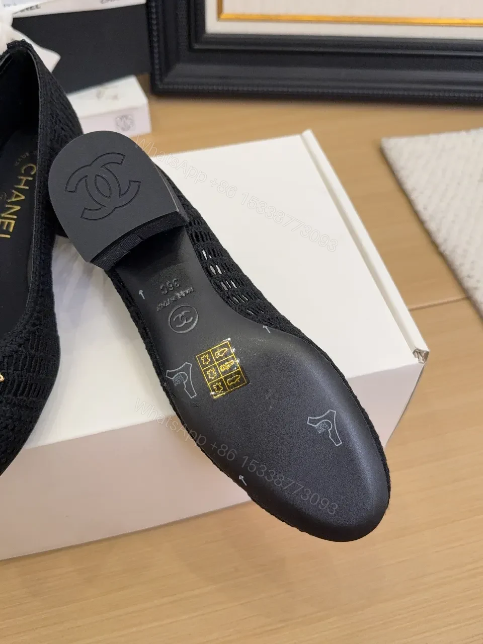 View 5 of Elegant Quilted Black Loafers with Gold Emblem: Everyday Luxury