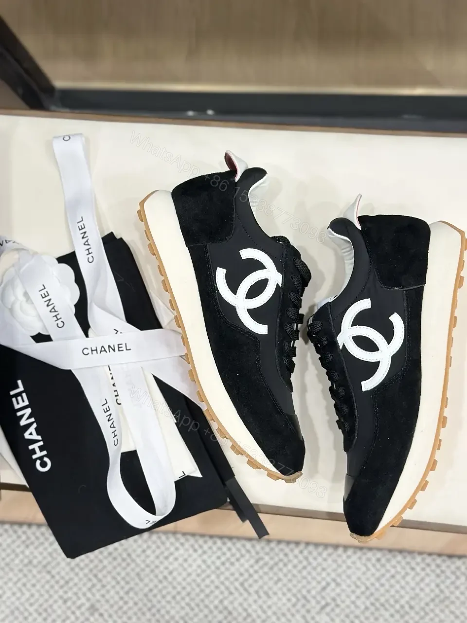 View 8 of Sleek Black Knit High-Top Sneaker with Signature Emblem, Luxury