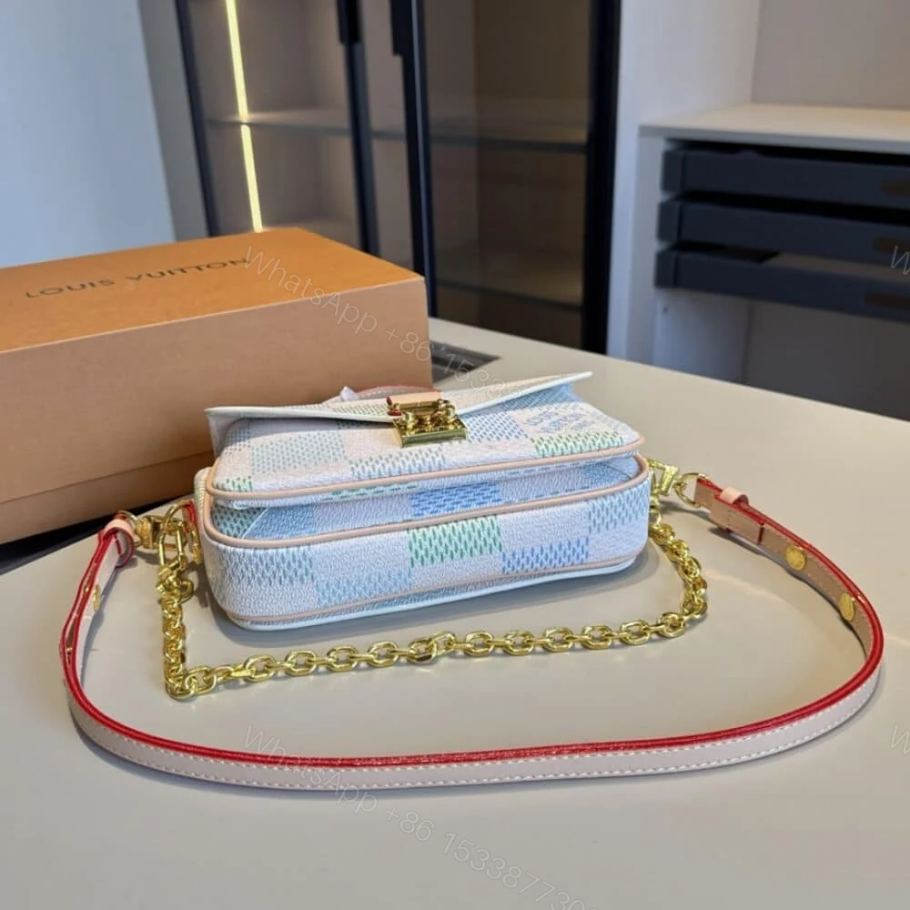 View 3 of Louis Vuitton Pochette Métis East West Damier Light Blue 21Cm N40749