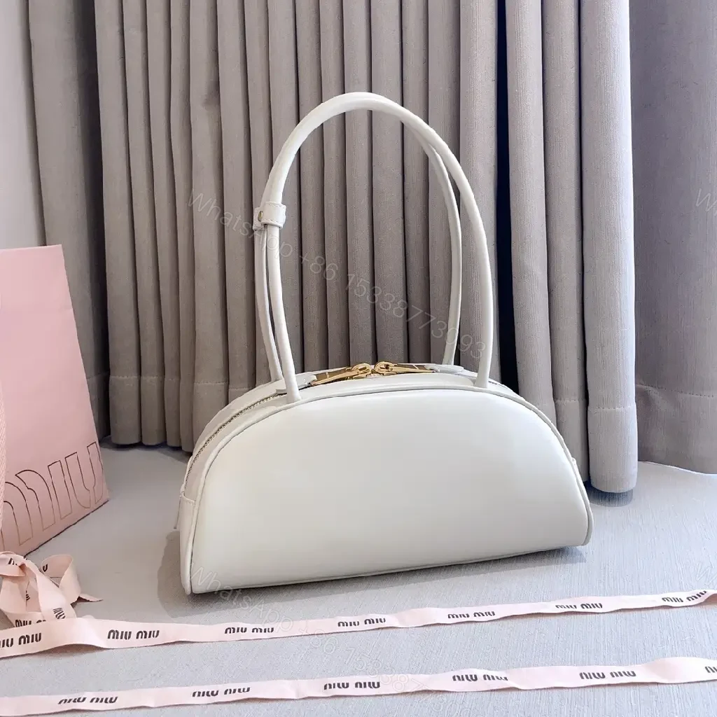 View 8 of Light Leather Dome Bag in Soft Hue, Compact Day-to-Night Carry