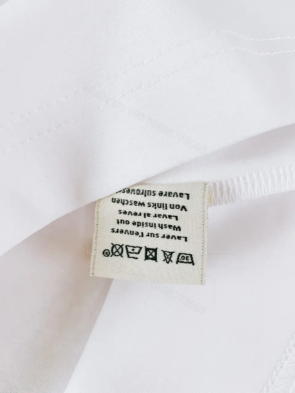 View 5 of Minimalist White Tee with Bold Orange Emblem T-Shirt