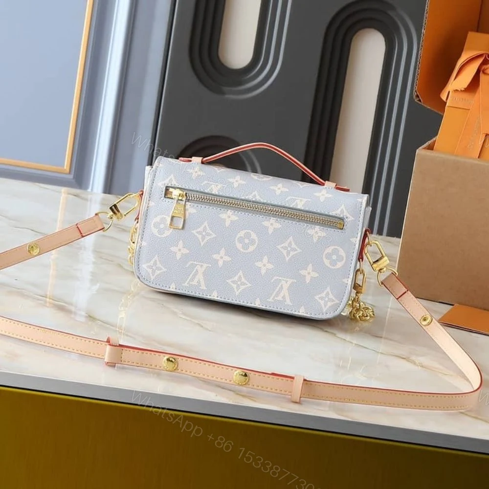 View 4 of Louis Vuitton Pochette Métis East West Coated Canvas Trianon 21Cm M12429