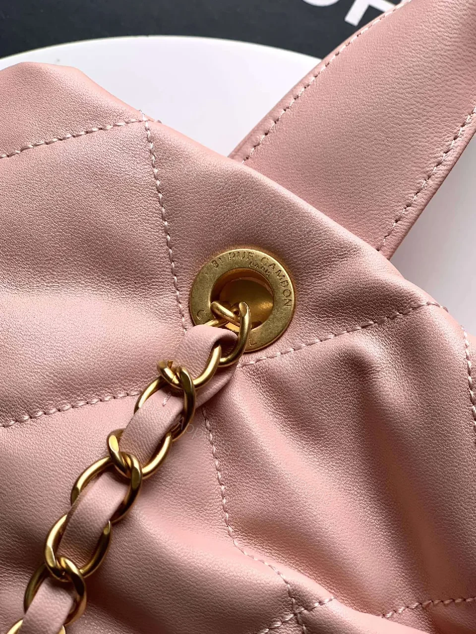 View 4 of Soft Pink Quilted Handbag with Gold Accents, Compact Luxury Tote