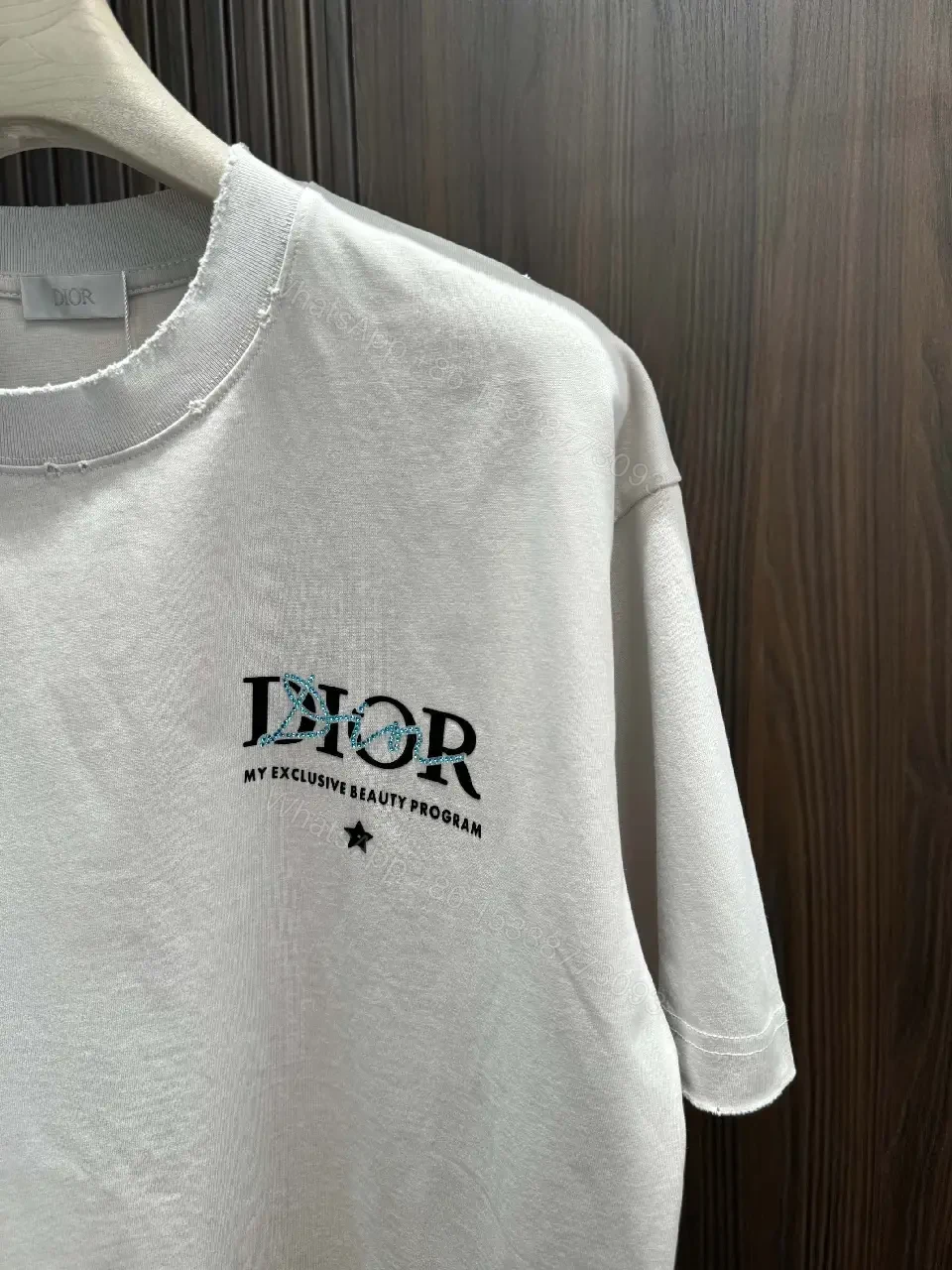 View 5 of Minimalist Logo Tee: Elevated Everyday Comfort, Off-White, Cotton Blend, Relaxed Fit, Short Sleeve Tee