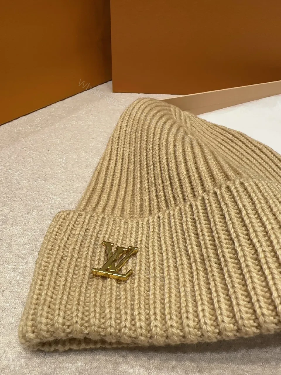 View 4 of Textured Camel Knit Beanie with Gold Crest - Cozy Luxury Style