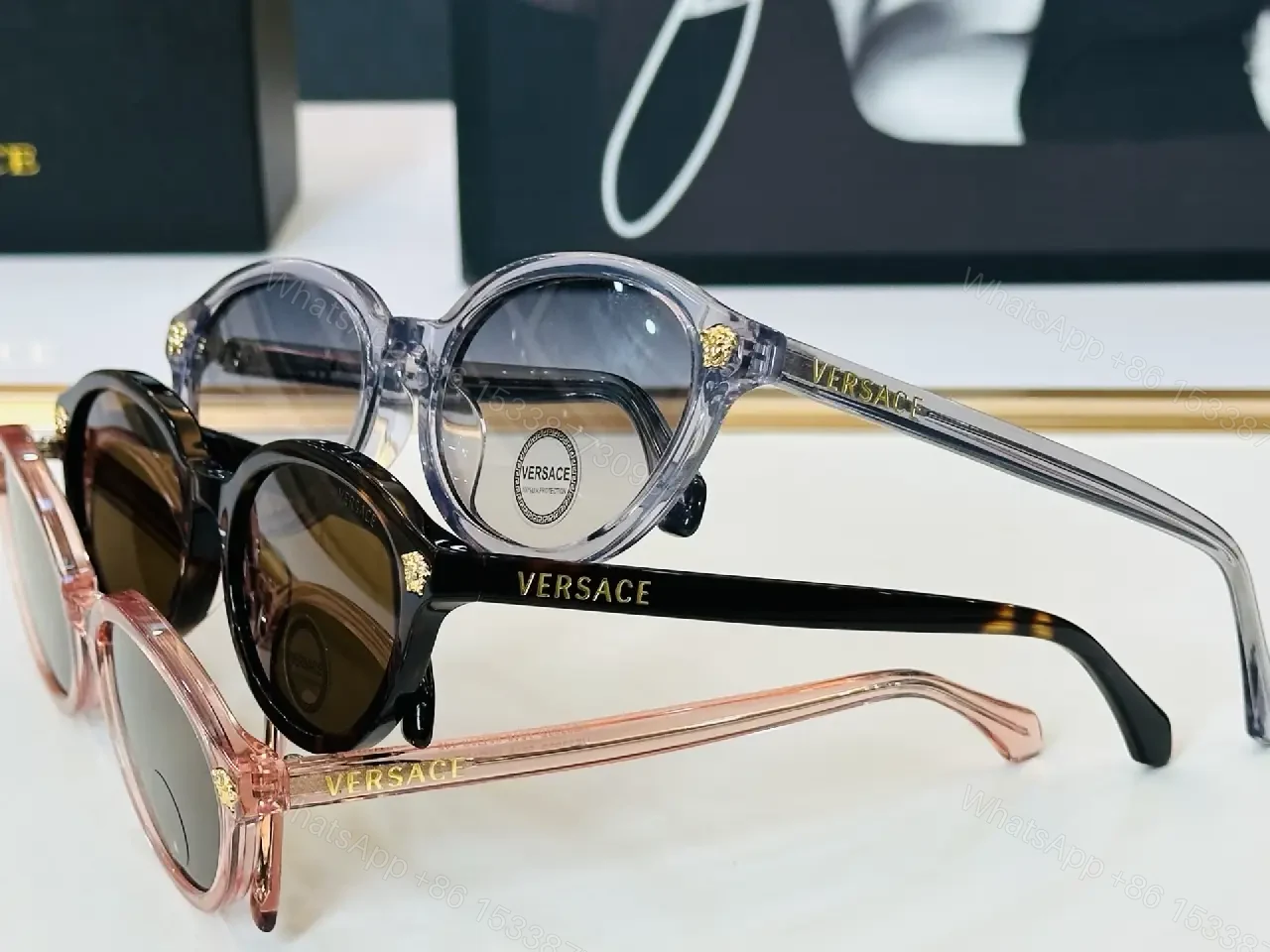 View 7 of Glassy Black Round Sunglasses with Gold Accents, UV400 Protection