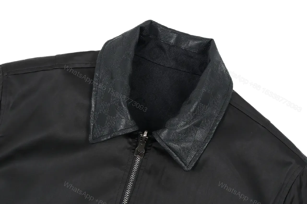 View 7 of Black Leather-Trim Coach Jacket with Subtle Logo Embroidery