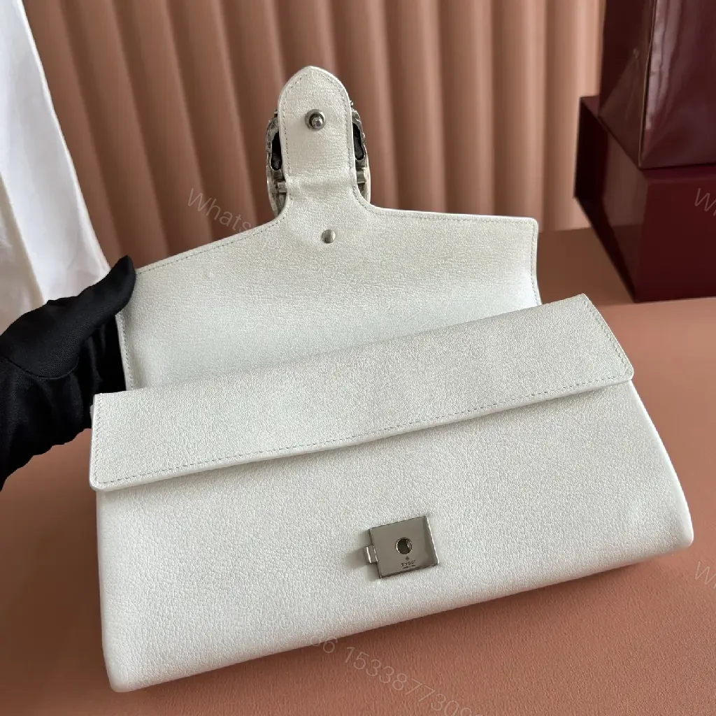 View 2 of Off-White Cream Pebbled Leather Structured Flap Bag with Gold Horseshoe Clasp