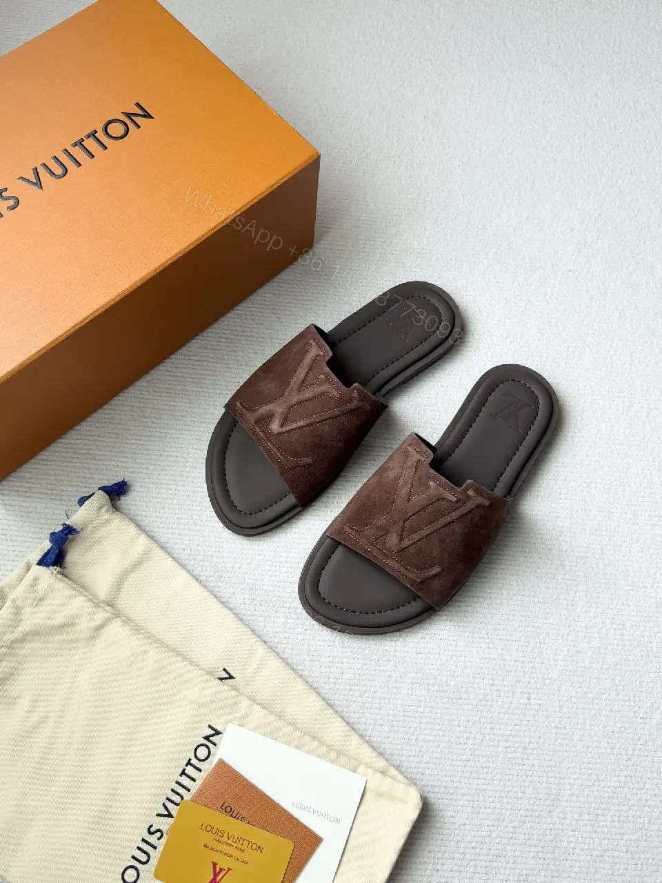 View 2 of Textured Suede Slide with LV Detailing